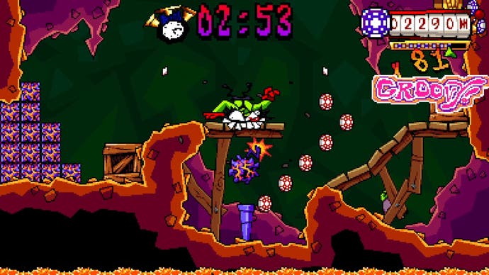 A man smashes his teeth into the platform of a cave level in Antonblast.