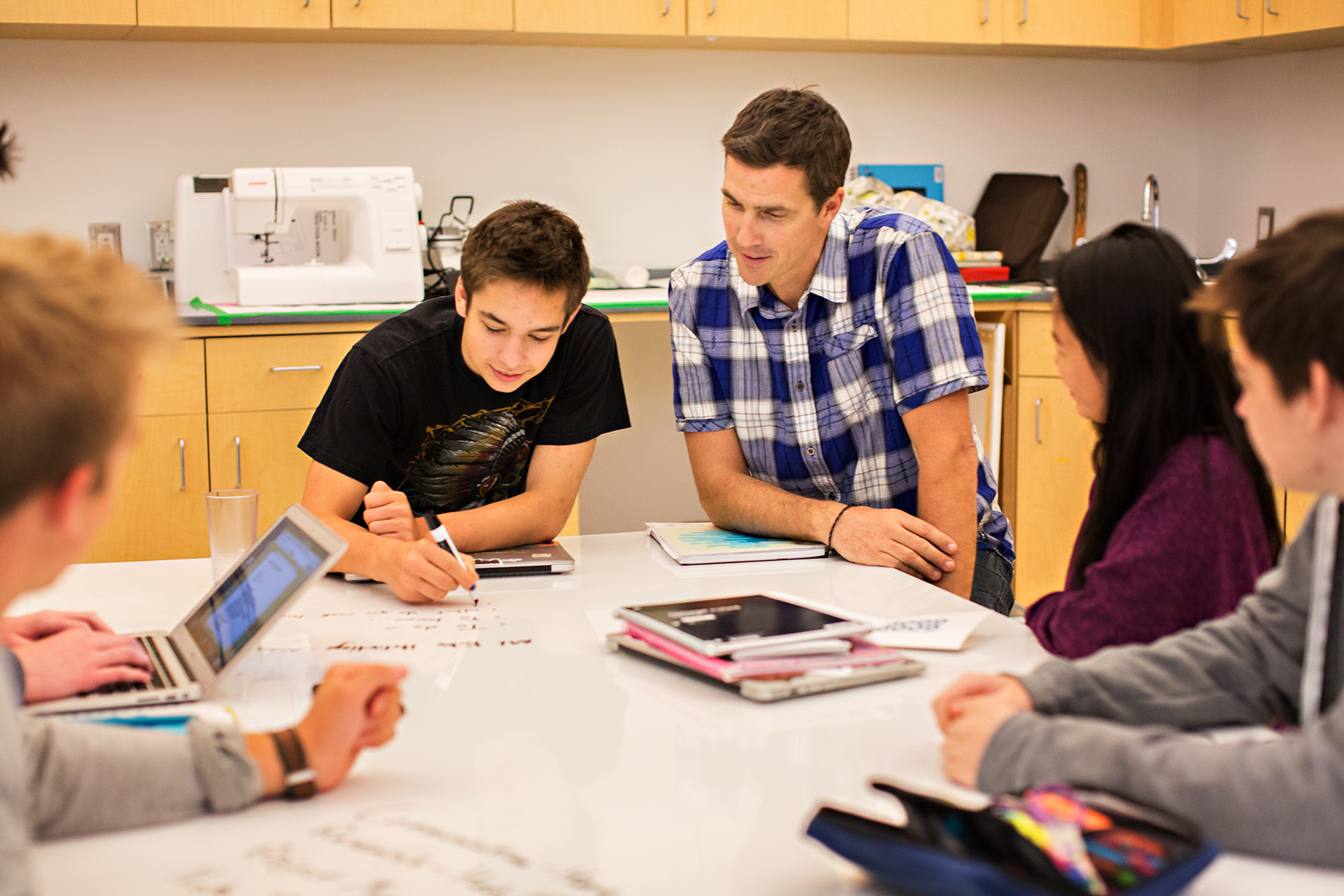 One Stone Coach working with students