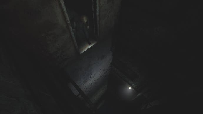 James looking down at a big drop into the Prison area in Silent Hill 2.