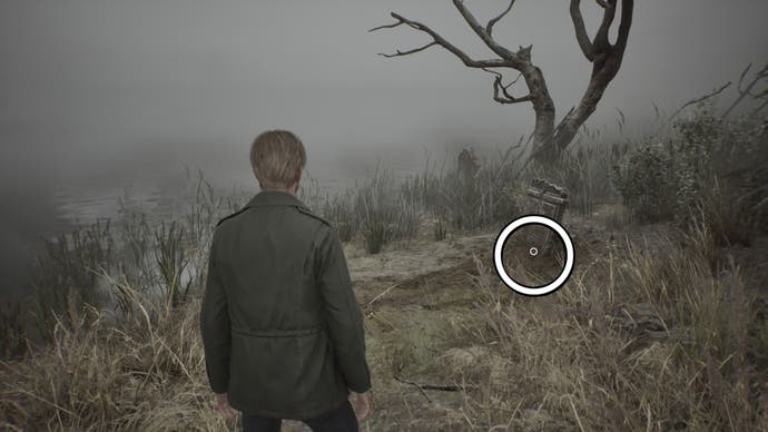 A white circle showing the Crimson Ceremony item under a gravestone in Silent Hill 2.