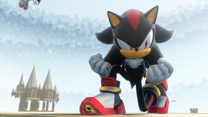 Shadow the black hedgehog crouches on the ground holding his fists