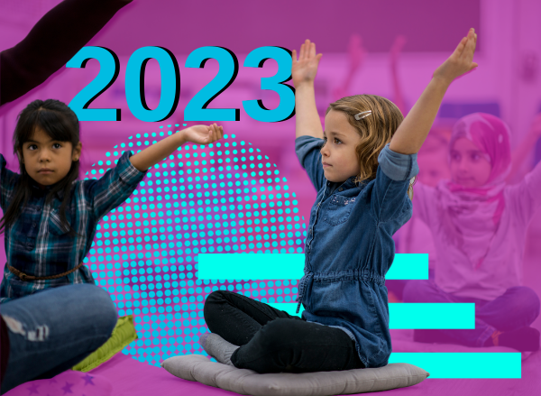 Young students stretching in a classroom with a purple background and 2023 in large font