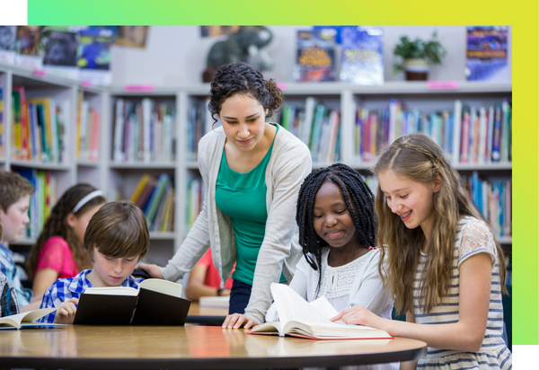 A teacher facilitates a discussion with her elementary school students.