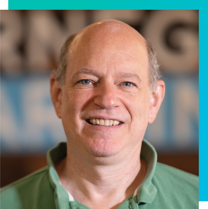 Headshot of Dr. Steve Ritter, Carnegie Learning Chief Scientist and Founder, standing in front of Carnegie Learning background