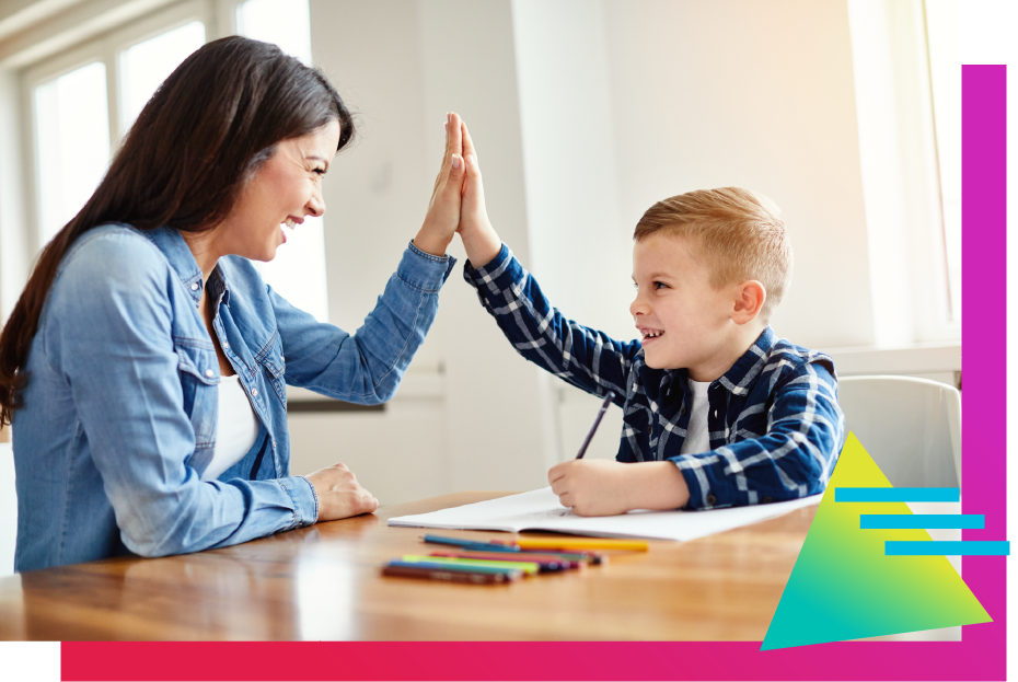 A parent and child celebrate after homework is done. 