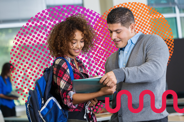 Hispanic teacher helping a native or heritage Spanish-speaking student by looking at her homework.